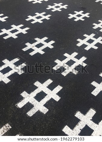 Has tag symbol on asphalt.A hashtag is a metadata tag that is prefaced by the hash symbol, #. Hashtags are widely used on microblogging and photo-sharing services 