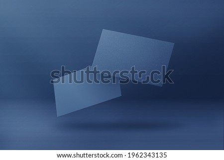 blank business cards on blue background