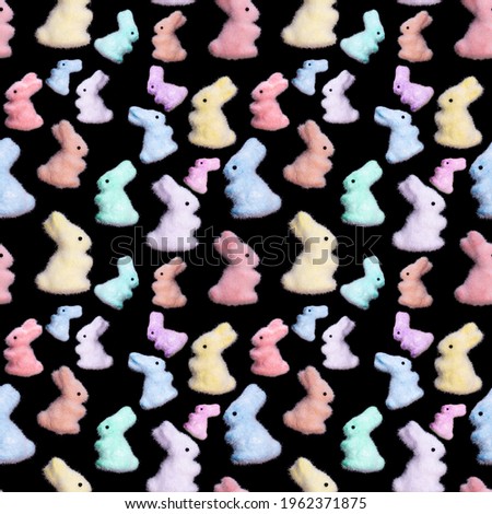 seamless pattern of colored rabbits isolated on a black background. High quality photo