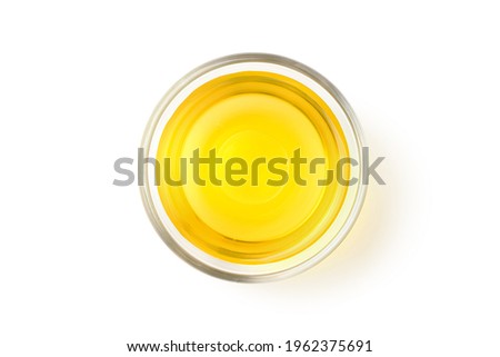 Flat lay of Vegetable Cooking Oil in glass bowl isolated on white background. Clipping path