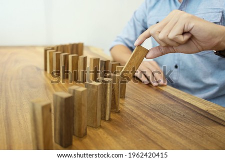 Man hand arranging wood block stacking
Business planning development concept