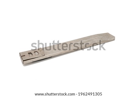 Old cutter knife isolated on a white background.