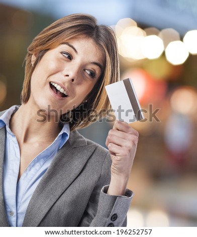 portrait of an executive young woman looking her credit card
