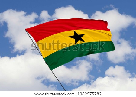 Ghana flag isolated on sky background with clipping path. close up waving flag of Ghana. flag symbols of Ghana.