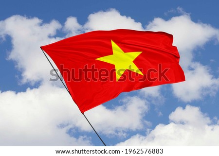 Vietnam flag isolated on sky background with clipping path. close up waving flag of Vietnam. flag symbols of Vietnam.