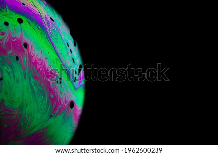 Colourful bubbles. Abstract galaxy background with globe planet earth in universe space with sunlight on dark background. Abstract colorful soap bubble