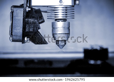 Modern 3D printer printing figure close-up. Automatic three dimensional Royalty-Free Stock Photo #1962625795