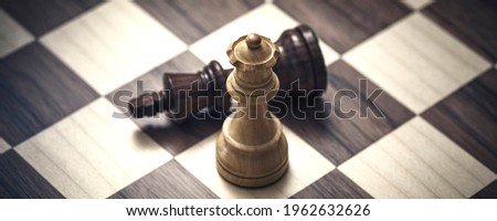 Chess strategy game: the black king is checkmated and defeated Royalty-Free Stock Photo #1962632626