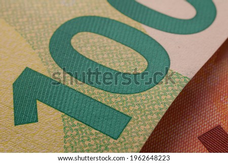 Series of macro shots of details of 100 euro bill. Security features and design. Close-up of number 100 Royalty-Free Stock Photo #1962648223