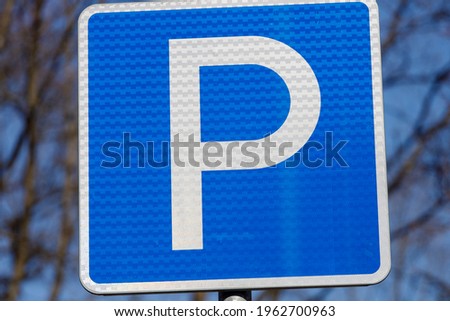 road sign in the blue sky. parking spot. High quality photo
