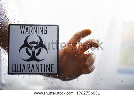 Quarantine. Quarantine warning sign on a glass door in hospital isolator. Isolation of patients with the virus in special laboratories. Virus.