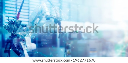 Engineer smart factory automated machine AR augmented reality technology futuristic industry technology robot arm control future industrial concept Royalty-Free Stock Photo #1962771670