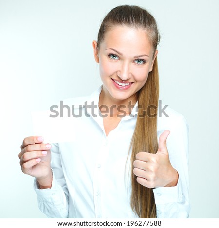 happy smiling successful business woman holding blank credit visit card. beautiful woman.