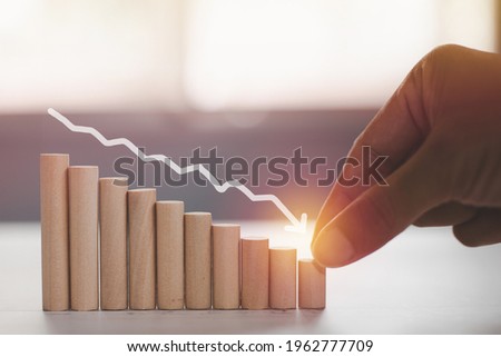 The sorted business bar chart tends to decrease, resulting in profit and loss, Woodblock down the graph, Risk management business financial and managing concept