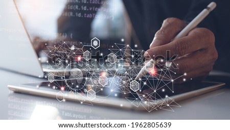 Ai, Artificial Intelligence, Digital technology, metaverse, software development, IoT Internet of Things concept. Software engineer using digital tablet, coding on laptop, javascript computer code Royalty-Free Stock Photo #1962805639
