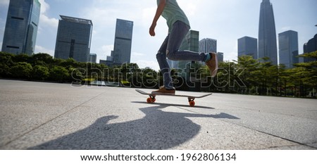 Skateboarder skateboarding at sunrise city