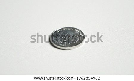 Rupiah coin on white background.