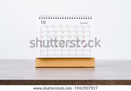 October Calendar 2021 on wooden table background. Royalty-Free Stock Photo #1962907927