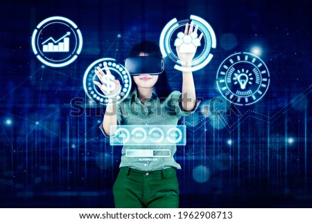 Double exposure of businesswoman using a VR glasses while touching virtual screen with cyberspace background