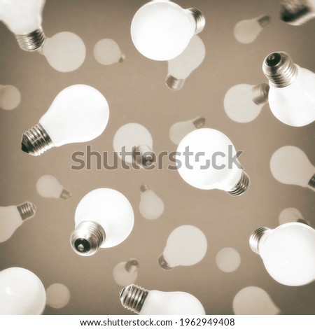 Abstract pattern with falling light bulbs. The concept of new ideas, creativity, revolutionary discoveries.
