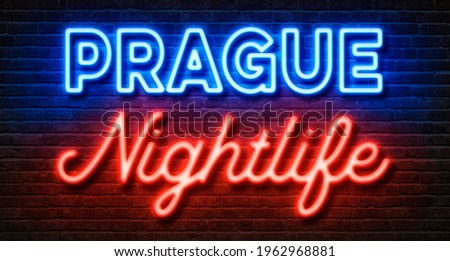 Neon sign on a brick wall - Prague Nightlife