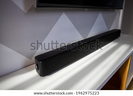 soundbar in a modern home. Listening to music watching movies in dolby surround Royalty-Free Stock Photo #1962975223