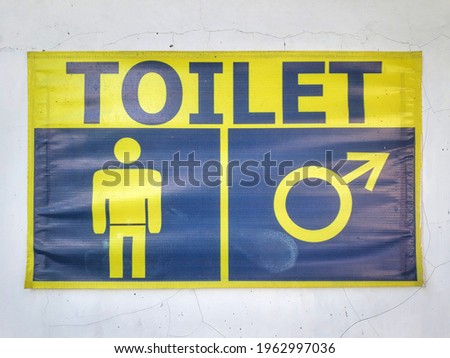 A men's toilet logo in a public service building in Indonesia.