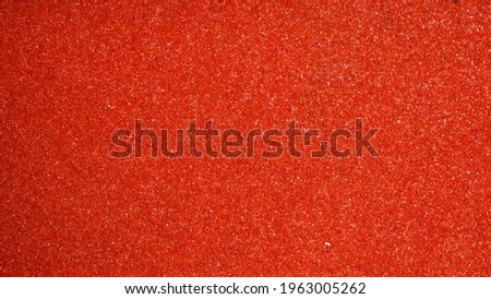 grainy orange background for wallpaper or texture