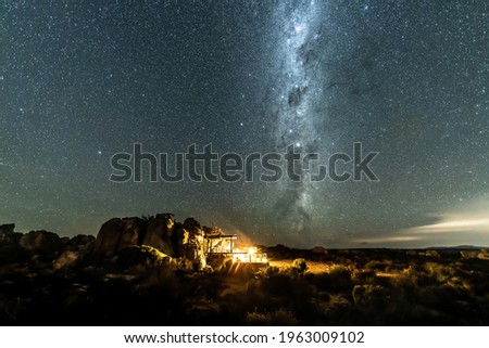 Scenery night sky with Milky way and million of stars with camping fire lights