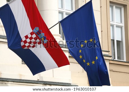 Flags of Croatia and European Union on Croatian Parliament building in Zagreb. Royalty-Free Stock Photo #1963010107