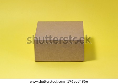 Eco box on yellow background.