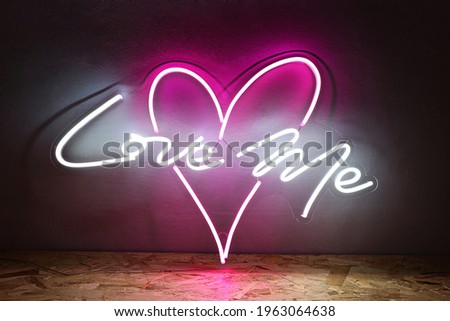 White and pink neon heart with the inscription love me. Trendy style. Wedding design. Neon sign. Custom neon. Home decor. 