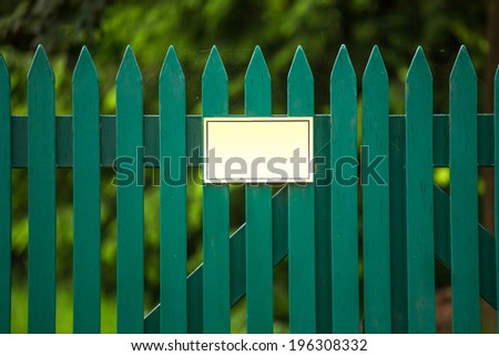 garden fence with a empty sign