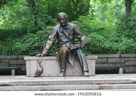 Bronze Statue reading book to a duck Royalty-Free Stock Photo #1963090816