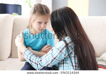 Little offended girl is reassured by her mother Royalty-Free Stock Photo #1963114264
