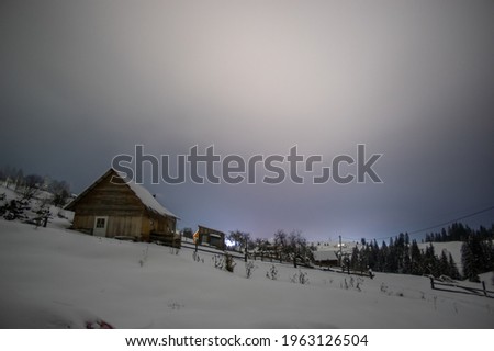 Night in winter in the Ukrainian village in the Carpathian mountains