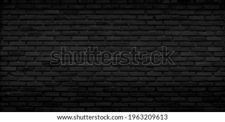 Old brick black color wall, vintage old brick background. Royalty-Free Stock Photo #1963209613