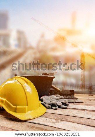Equipment and tools for building construction on wood background. Labor day and worker concept. Royalty-Free Stock Photo #1963233151