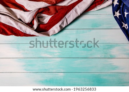 Close up of waving national usa american flag. The flag of the United Sates of America on a grey plank background with memorial day.