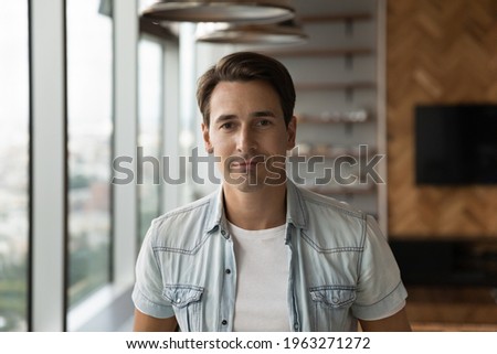 Close up profile picture of young Caucasian businessman pose in own modern office show leadership qualities. Headshot portrait of millennial 30s successful male CEO or boss. Recruitment concept. Royalty-Free Stock Photo #1963271272