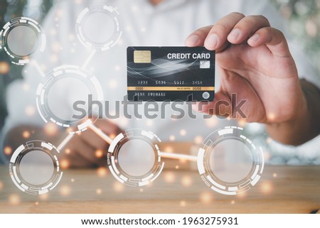 Man hand holding credit card with empty diagram for your design