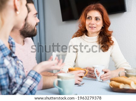 Young married couple and senior mother having bad discussion. High quality photo Royalty-Free Stock Photo #1963279378