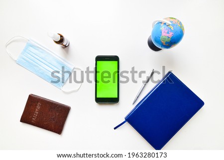 Mock up display pandemic travel planning concept. Laptop white table summer Holiday Vacation background concept. calendar notebook, Laptop, passport, bank card, disinfectant bottle, accessories.