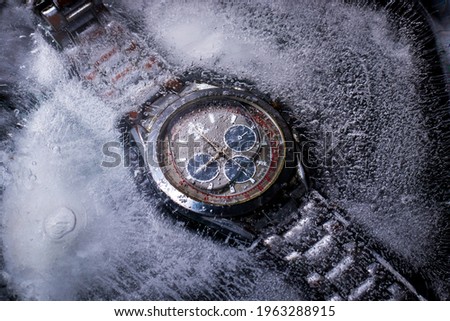 picture of a wrist watch trapped in ice