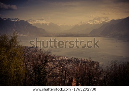 landscape view of the lake of Geneva, with the Swiss Alps in the background, shot in Vevey, Vaud, Switzerland 