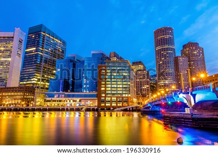 Boston Harbor and Financial District at twilight in Boston, Massachusetts.