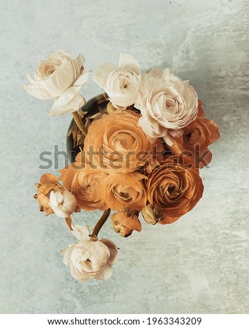 Ranunculus or persian buttercup bouquet of flowers, spring, colorful, bright, in a vase, toned picture, top view.
