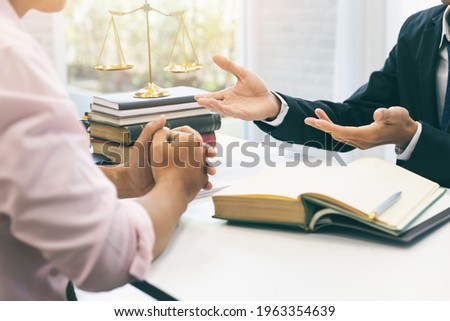 Businessman and lawyer discussing the contract. Sign a contract business. Treaty of the law. Law and Legal services concept.