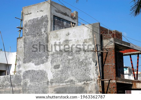 Stock photo of newly built home in residential are in kolhapur city Maharashtra India, focus on object. work in progress.
