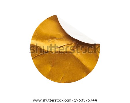 Blank golden round adhesive paper sticker label isolated on white background